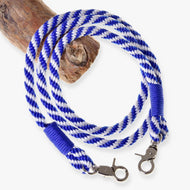 LarDen Hobby Horse Reins Blue Stripe, blue and white rope reins with wrapped ends and silver clips on a wooden branch